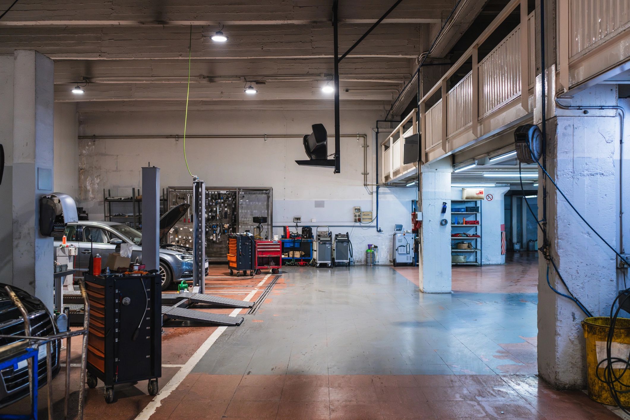 Auto body repair shop interior with lifts