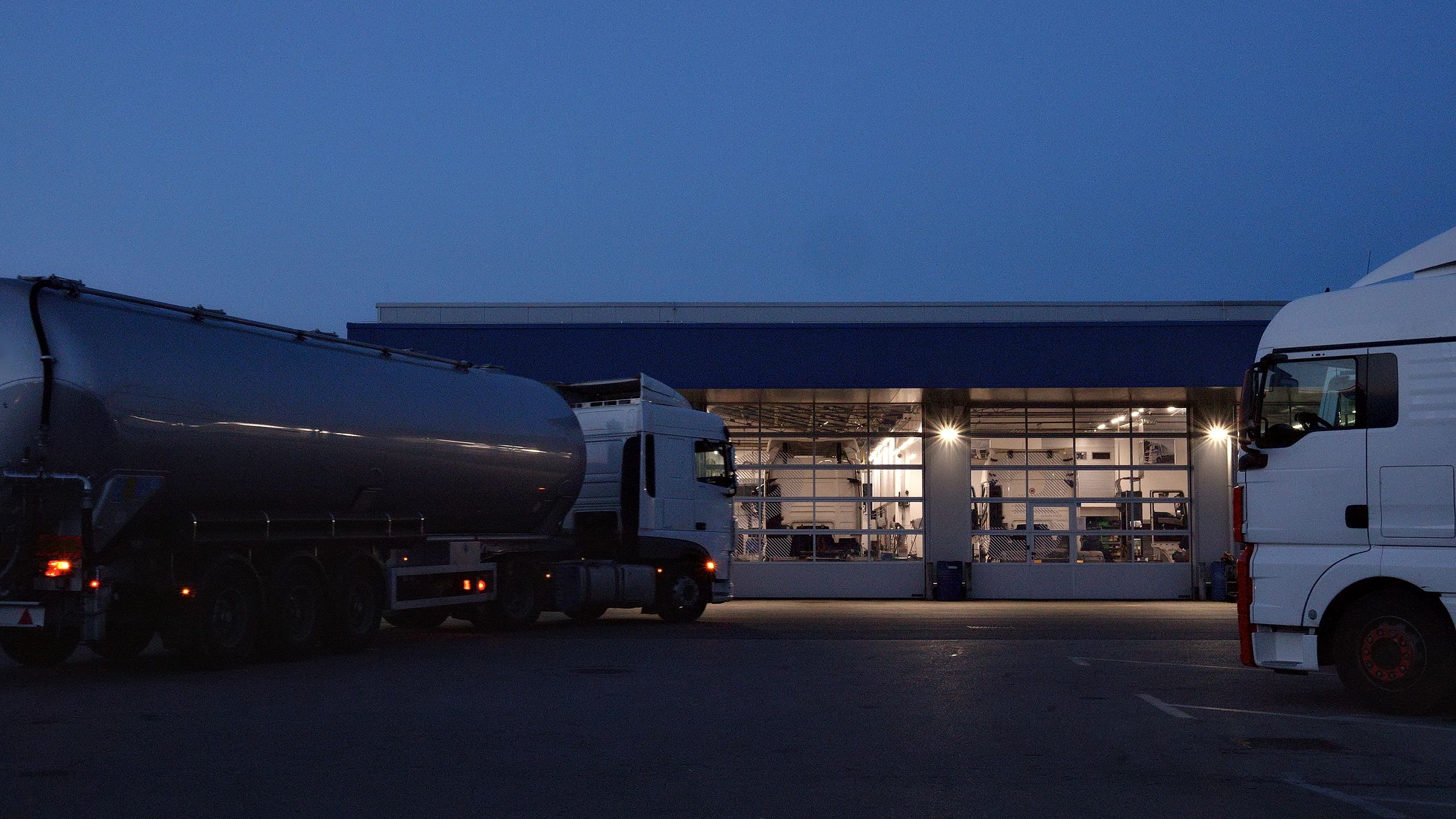 Auto repair shop exterior at dusk